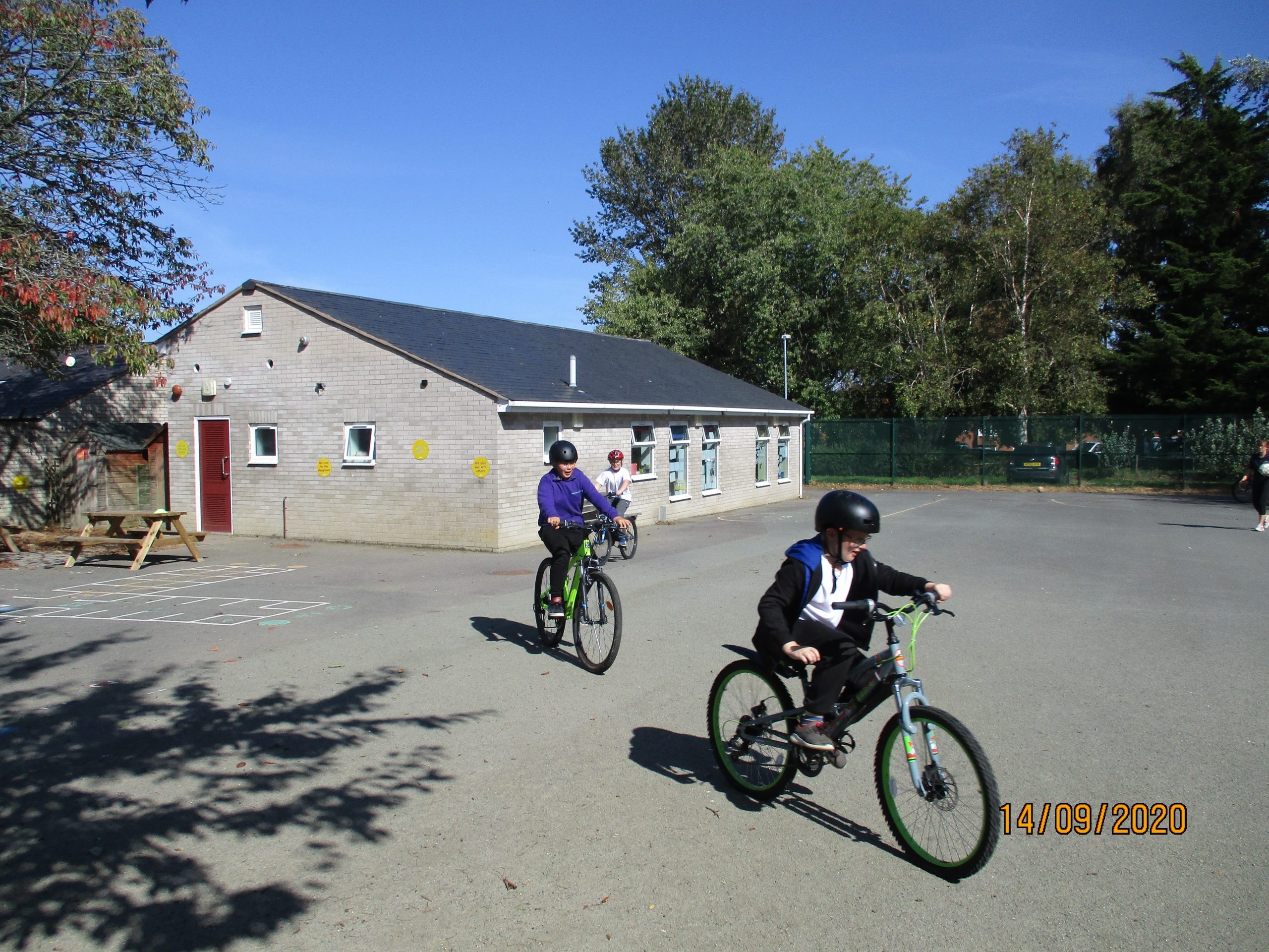 Three kids riding bikes