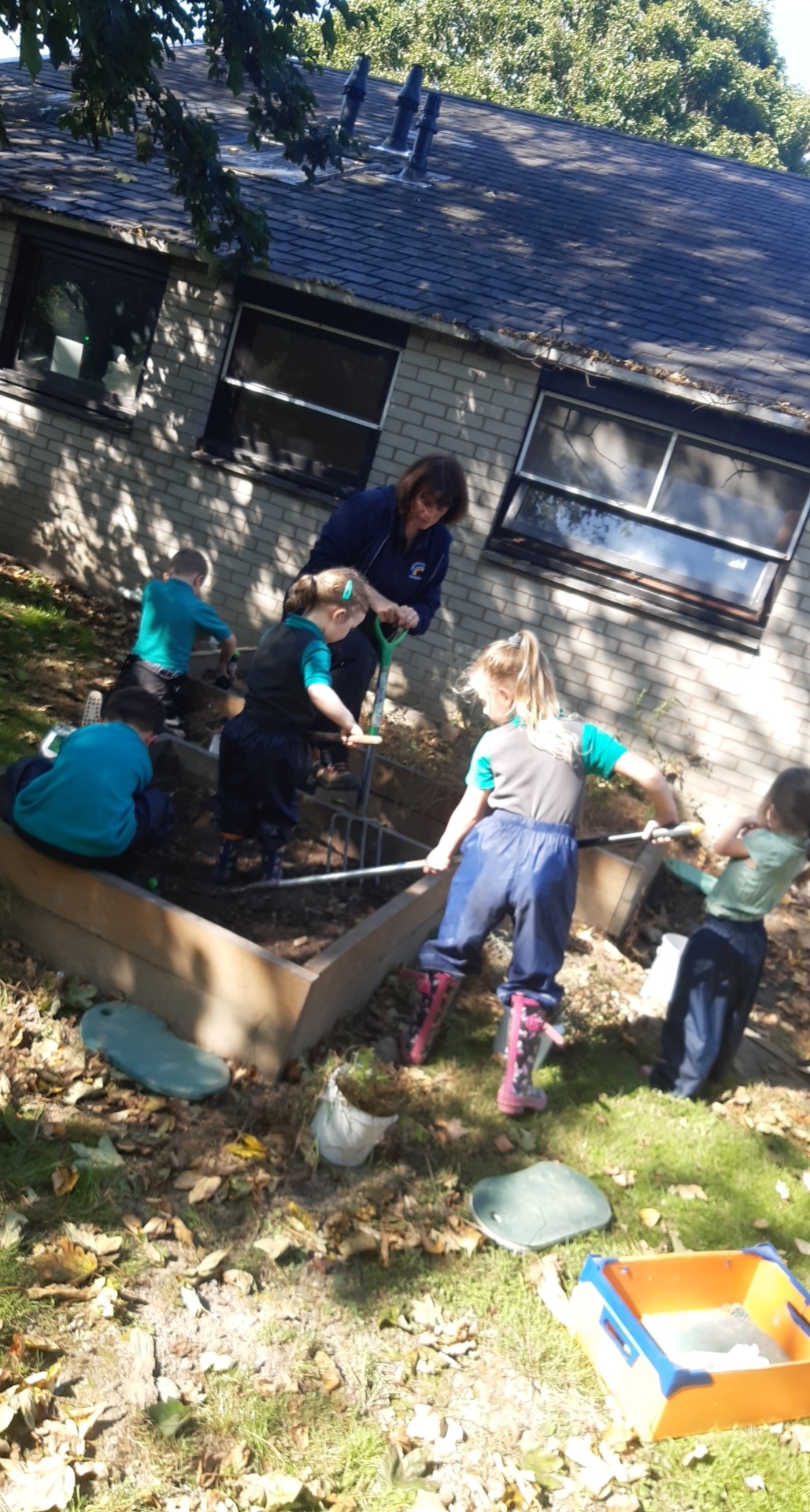 A group of kids working in the garden